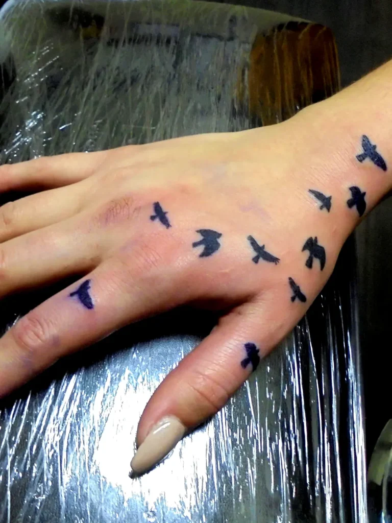 Bird Silhouette hand tattoo