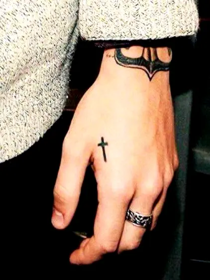 Cross tatto on hand